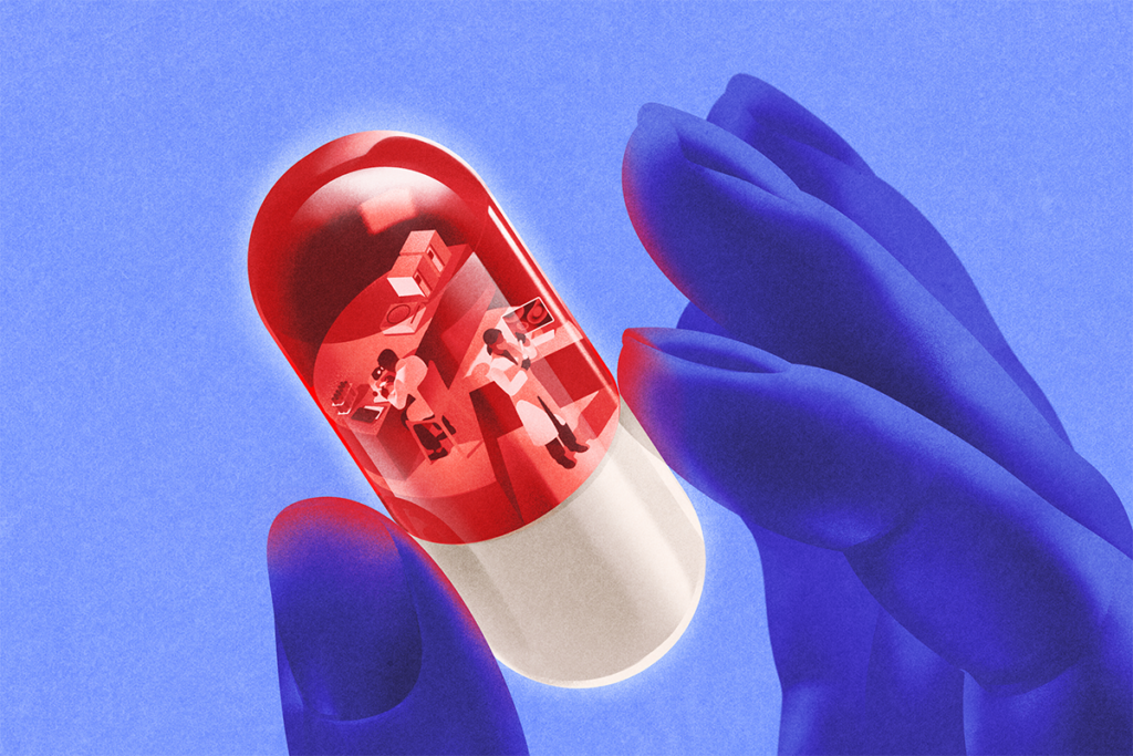 Close up of thumb and forefinger holding a transparent red and white capsule pill with a lab inside it.