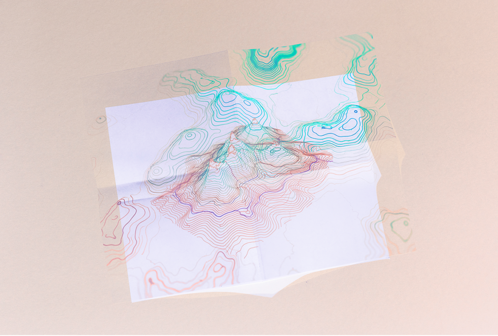 Illustration of a sheet of paper with a topography map-like pattern on it.